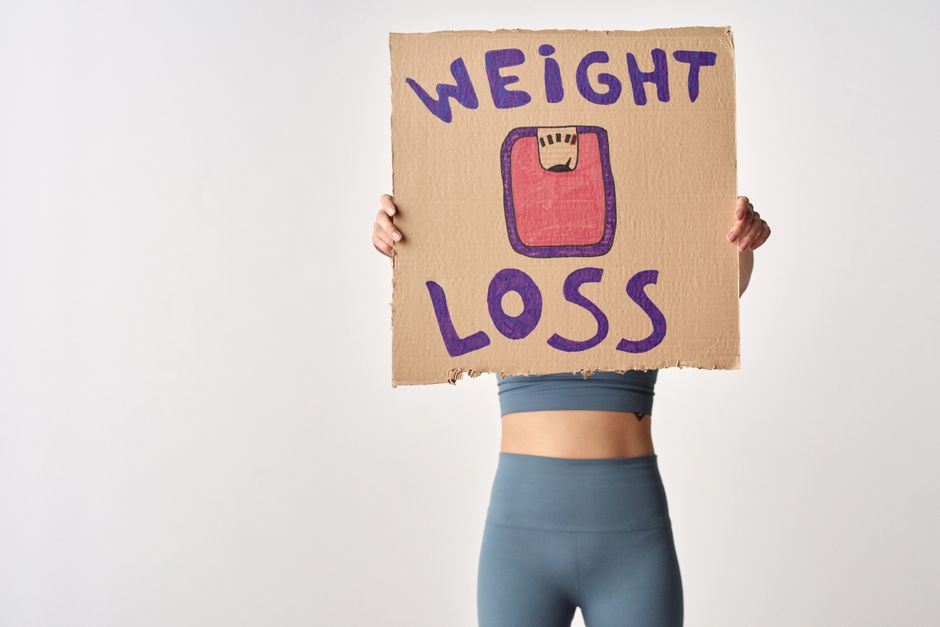 woman frustrated scale weight loss medical weight loss